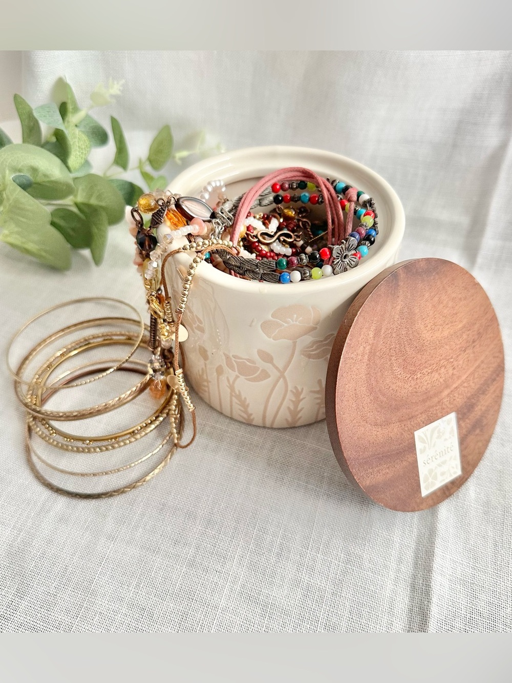 Assortment of jewelry lot + white floral container with wooden lid